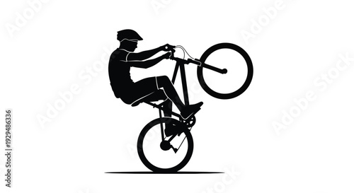 Man riding bicycle performing wheelie stunt on black silhouette against white background with dynamic motion and action