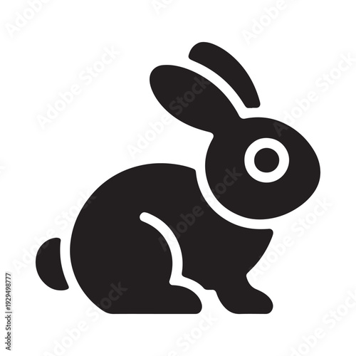 Simple black silhouette of a rabbit in a crouching alert position