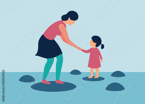 Supportive mother helping her little daughter step across stepping stones in calm water, holding her hand.