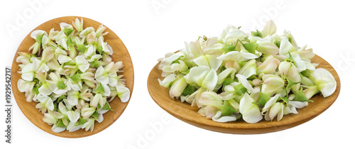 flowers of Sophora japonica or Styphnolobium japonicum in wooden bowl isolated on white background. Top view. Flat lay