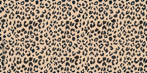 Seamless pattern of dark spots on a light tan background