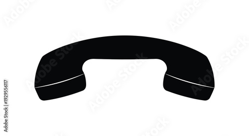 A stark black silhouette of a vintage telephone handset against a plain white background emphasizing communication and nostalgia silhouette