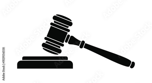 A striking black silhouette depicts a traditional gavel resting on a sound block symbolizing justice and legal proceedings silhouette