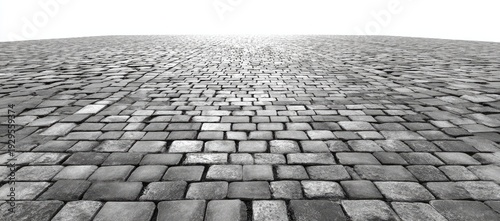 Infinite expanse of textured cobblestones recedes towards a bright horizon
