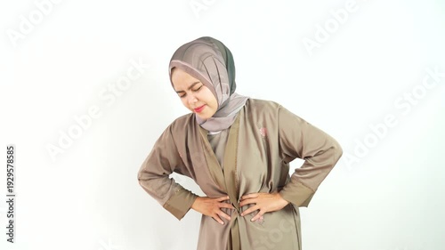 Muslim Woman with Displeased Expression and Hands on Hips Stomachache Gesture Isolated on White Background in Studio 4k Video