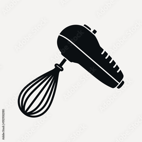 Black silhouette of a hand mixer with whisk attachment on a light beige background kitchen appliance