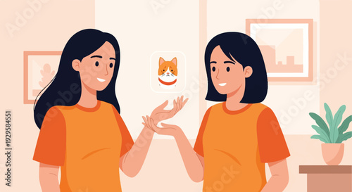 Two smiling women in orange shirts interact with a digital cat icon