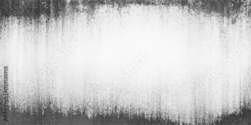 A misty morning landscape features a fountain in the park near a frozen pond where water drops on a wall reflect the blue winter sky and snow-covered forest trees