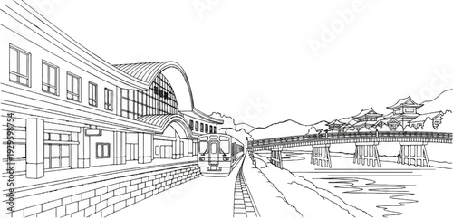 A train waits at a station next to a bridge with traditional buildings and mountains