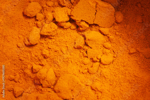 Tableau sur toile Turmeric powder natural spices as background.