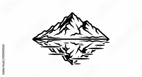 Jagged mountain peak reflected in calm water below