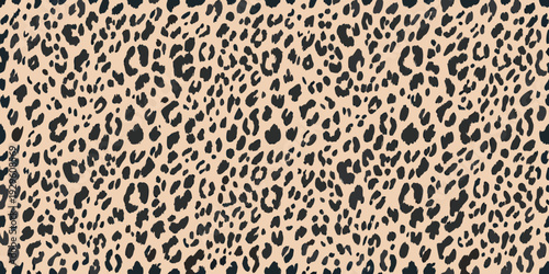 Seamless pattern of dark spots on a light beige background