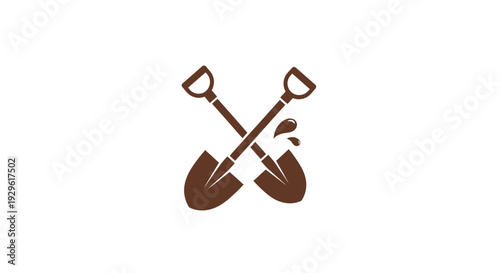 Two Brown Shovels Crossed Over Each Other.