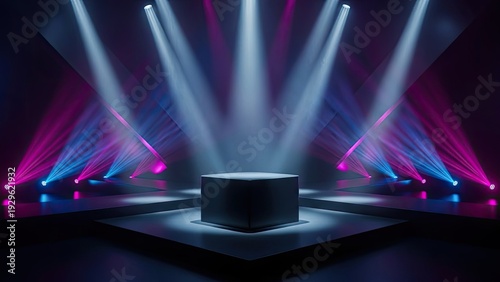 A dark stage with a cube in the center lit by vibrant spotlights