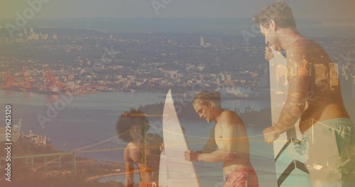 Three surfers pointing and inspecting board on bluff while city overlaying scene preparing to surf