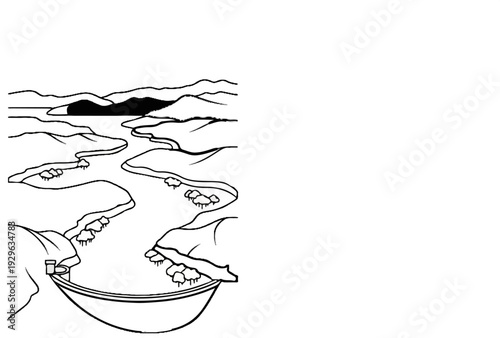 Aerial view of a winding river flowing through a valley towards a vast lake