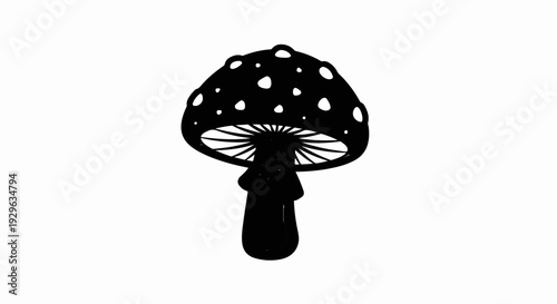 Black silhouette of a spotted mushroom on a white background