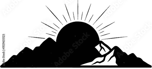 Silhouette of a sun rising over mountains with sunbeams radiating outwards