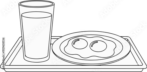 A glass of milk and two fried eggs on a tray