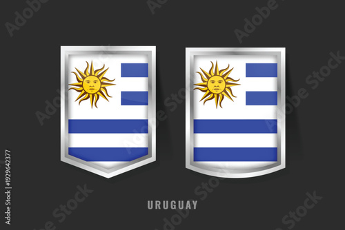 Free Download Vector illustration of Uruguay flag on 3D metallic shields. Features the Sun of May and nine blue and white stripes. National symbol of Uruguayan pride, history, and South American heritage - GFXLoad