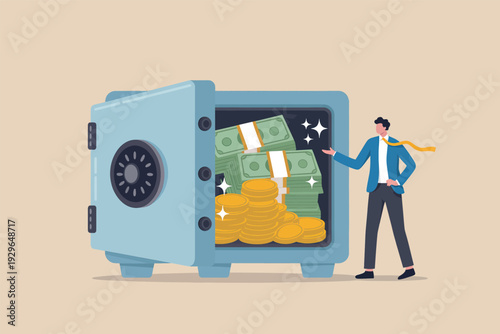 Businessman standing next to a large open safe filled with stacks of cash and gold coins