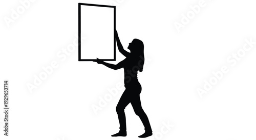 Silhouette vector graphic of a woman hanging a blank framed picture onto a white wall