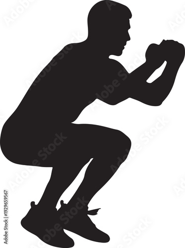 Man in dynamic squat position with fists clenched ready for action
