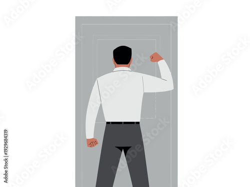 Businessman standing confidently in front of door with clenched fist raised high proudly