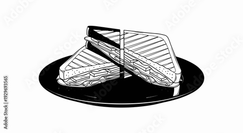 Two grilled sandwiches, cut in half, sit on a black plate