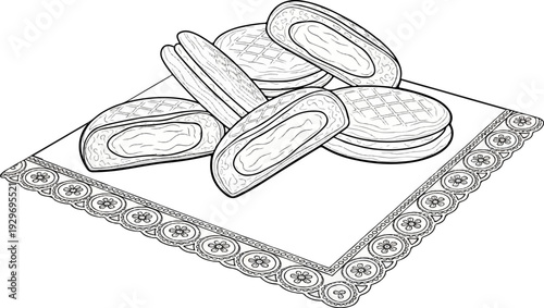 A cluster of filled pastries with a patterned border on a decorative cloth