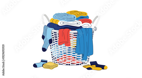 Woven laundry basket filled with various colorful folded clothing items and scattered socks isolated on white background.
