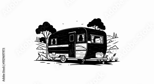 A retro camper trailer parked in a rustic landscape with trees and hills