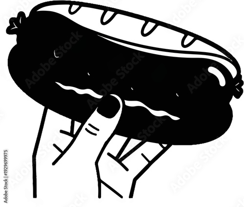 Hand holding a large, black, stylized hot dog with wavy lines suggesting a face