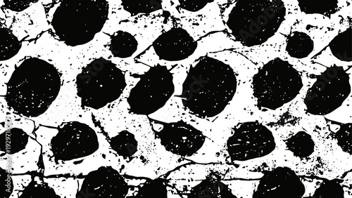 Abstract black and white spotted pattern with rough textured shapes and distressed grunge effect