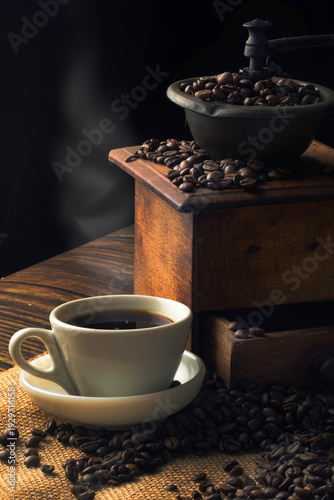 Aromatic Coffee Moment with Vintage Grinder. Dark mood still life