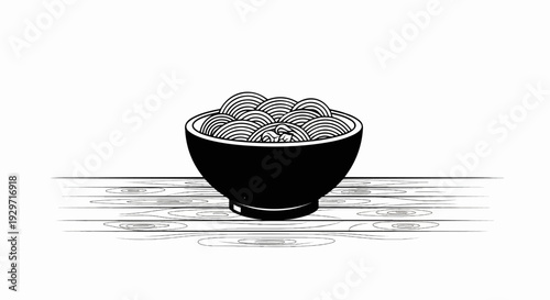 A black bowl overflows with coiled noodles, resting on a wooden surface