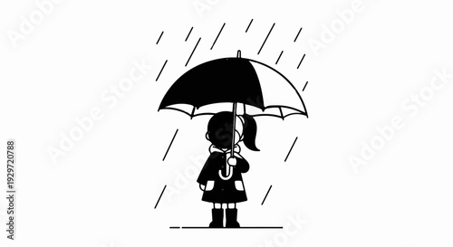 A child in a coat and boots stands under an umbrella in the rain