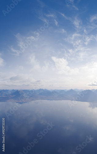 Serene Blue Mountain Landscape With Calm Lake Reflection Under Vast Cloudy Sky — 3D Rendering