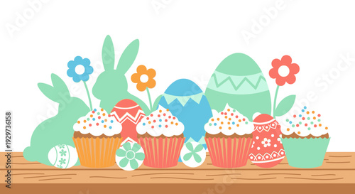 Colorful easter bunnies and cupcakes with decorative eggs on wooden table
