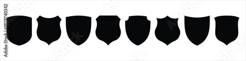 A row of eight black shields on a white background
