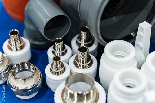 Workshop Inventory Includes Pipes Adapters. Metal Fittings And Plastic Conduits Prepared For Use. Workshop Tools And Parts Organized For Upcoming Repair Jobs And Maintenance Activities