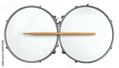 Two large, white drum surfaces side-by-side with a wooden stick laid across