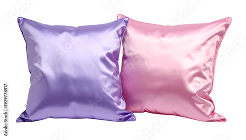 Two satin pillows, one purple and one pink, against a black background