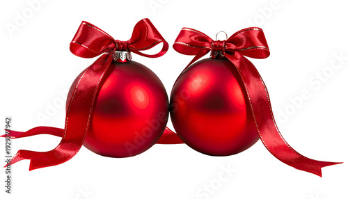 Two shiny red ornaments with ribbon bows, against a black background
