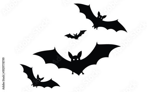 Black bat silhouettes flying together in the night sky