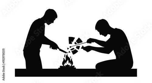 silhouette of two men building fire together