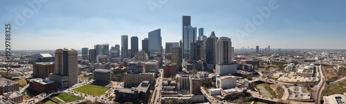Houston Texas Downtown Skyline on Sunny Day; Urban Cityscape with Traffic Flow on Highway and Modern Skyscrapers
