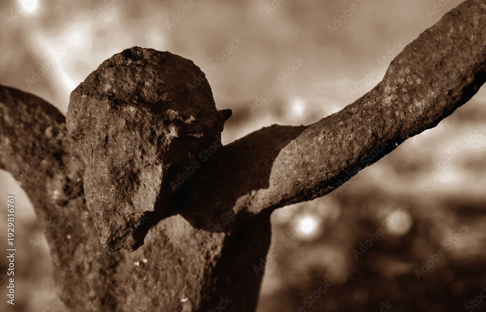 Obraz premium Authentic ancient iron crucifix depicting Jesus Christ, heavily weathered by time, symbol of faith, sacrifice, suffering, and historical Christian devotion.
