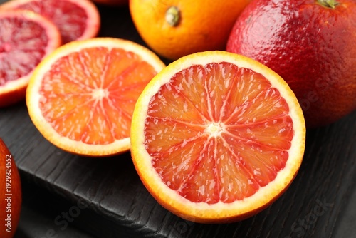 Cuadro en lienzo Whole and cut ripe Sicilian oranges on table, closeup