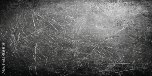 A dark grunge texture featuring a rough black and white marble stone pattern on an old metallic surface backdrop for a dirty gray material wallpaper design